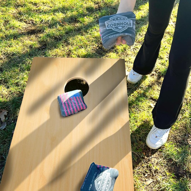 World Series of Cornhole Regulation Woodgrain Cornhole Set - 4'x2' Solid Wood Lightweight Outdoor Corn Hole Toss Game with 8 Bags and Carrying Case.