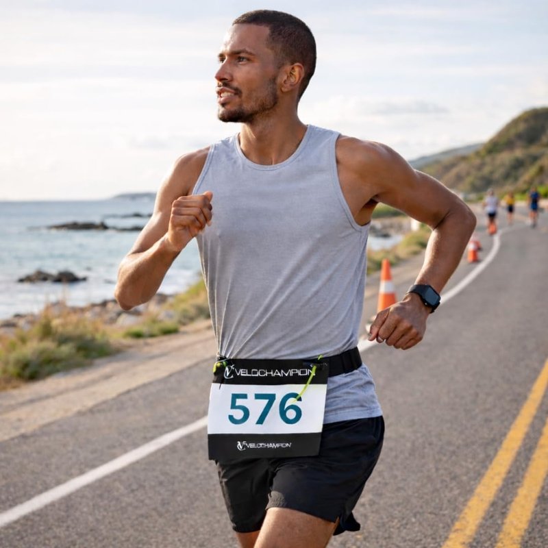 VeloChampion Lightweight Running Belt Waist Pack for Men Women - Elasticated Stretch Fit Race Number Holder - No Pins - 3 Sizes - Run. Triathlon. Cycle. Marathon. Jogging (1, Medium)