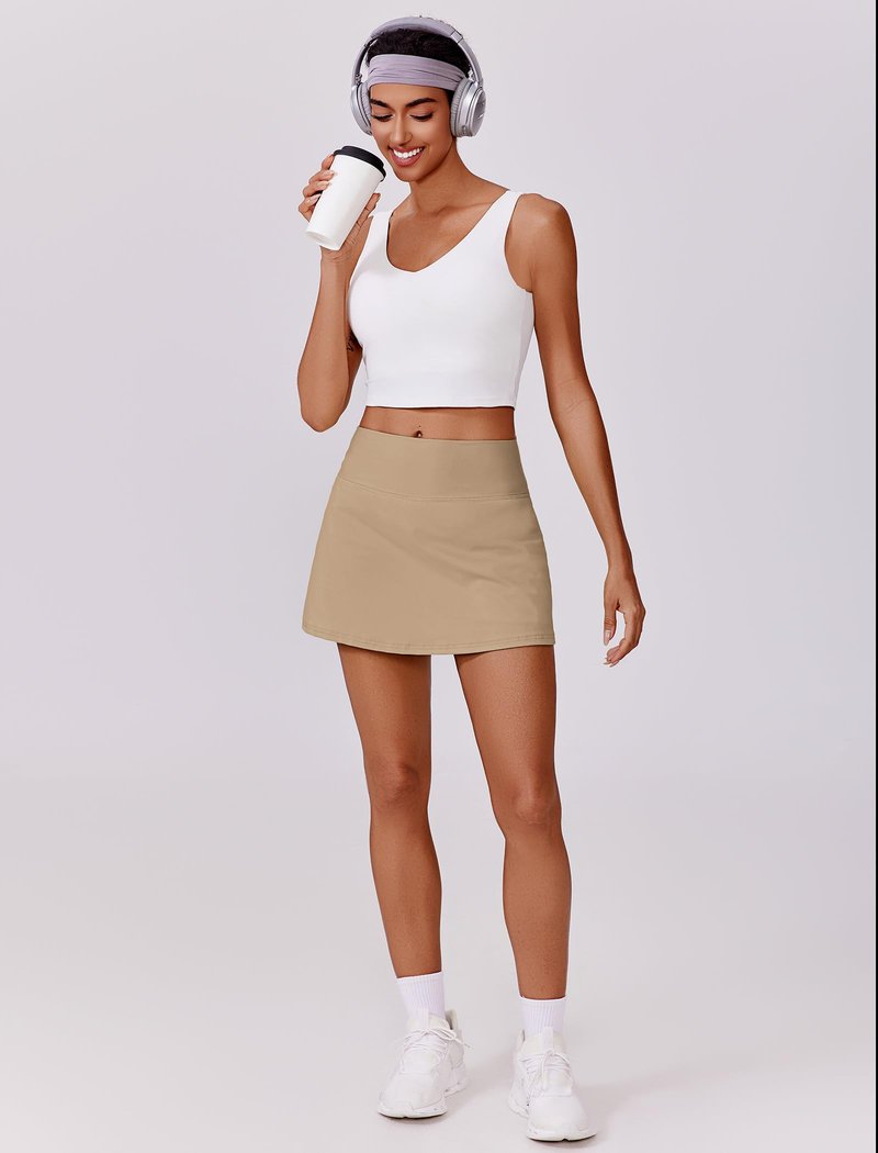 PINSPARK Tennis Skirts for Women V Waisted Golf Skorts Lightweight Athletic Skirt Stretchy Workout Skort with Pockets, Khaki Medium