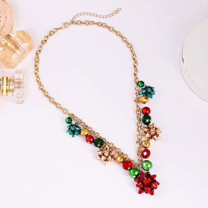 XOCARTIGE Christmas Necklace X-Mas Jingle Bell Necklaces Festive Bow Pendant Necklace Present for Women (A Gold)