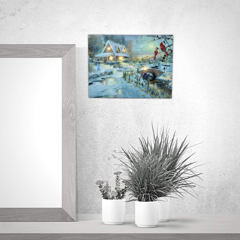 BANBERRY DESIGNS LED Christmas Wall Art - Lighted Cottage Along a Stream Christmas Scene with Cardinals and Snowman - LED Canvas Prints - Old Fashioned Cobblestone Bridge - Measures 11.75" x15.75"