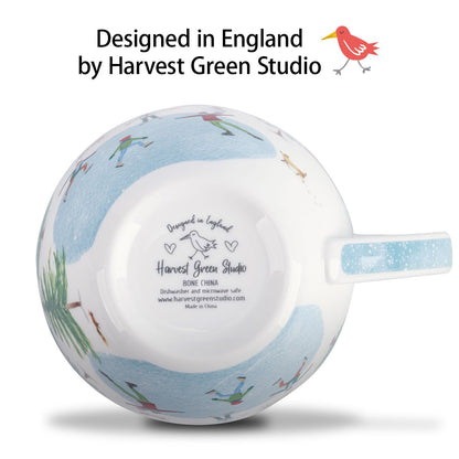 Christmas Skating Mug - 20 oz Bone China Winter Coffee Mugs with Snowy Village, Perfect Holiday and Christmas Gifts for Friends and Family - Designed in England by Harvest Green Studio