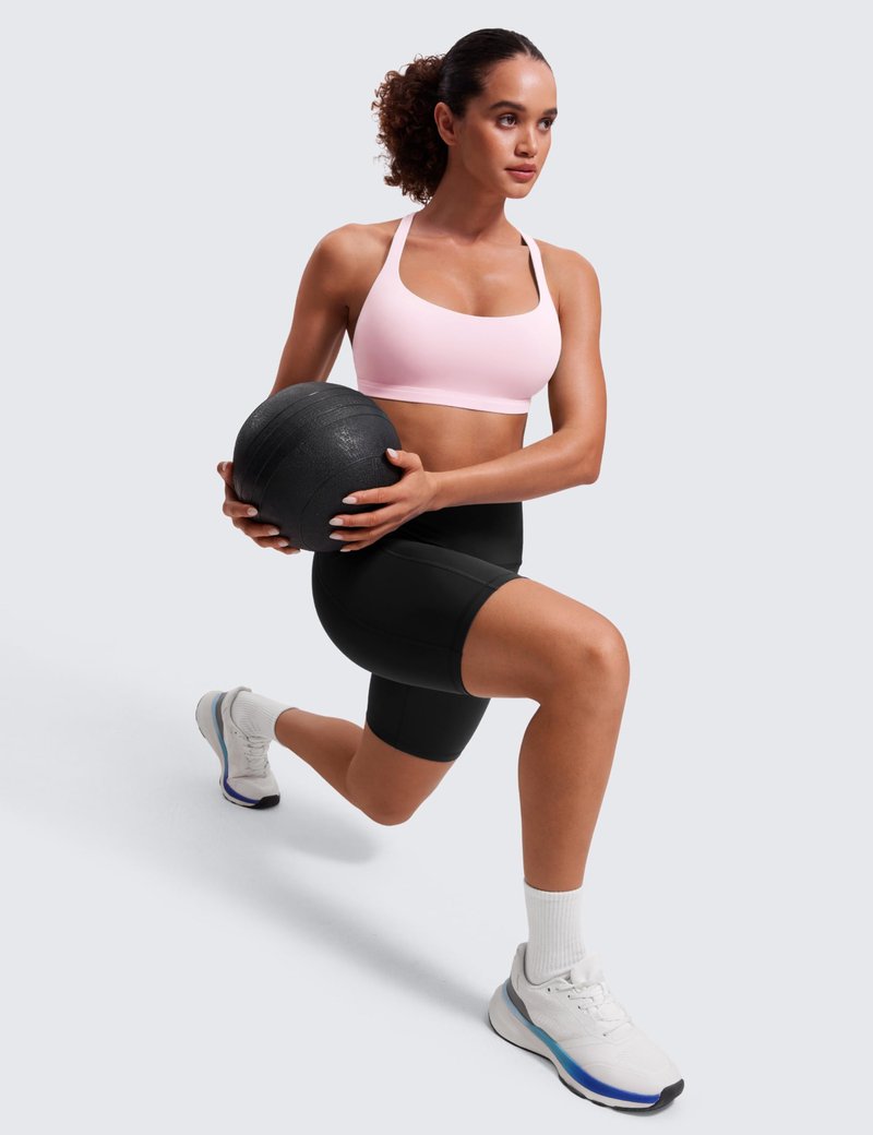 CRZ YOGA Naked Feeling Strappy Sports Bras for Women - Criss Cross Back Wireless Padded Cami Yoga Workout Top Strawberry Pink Small