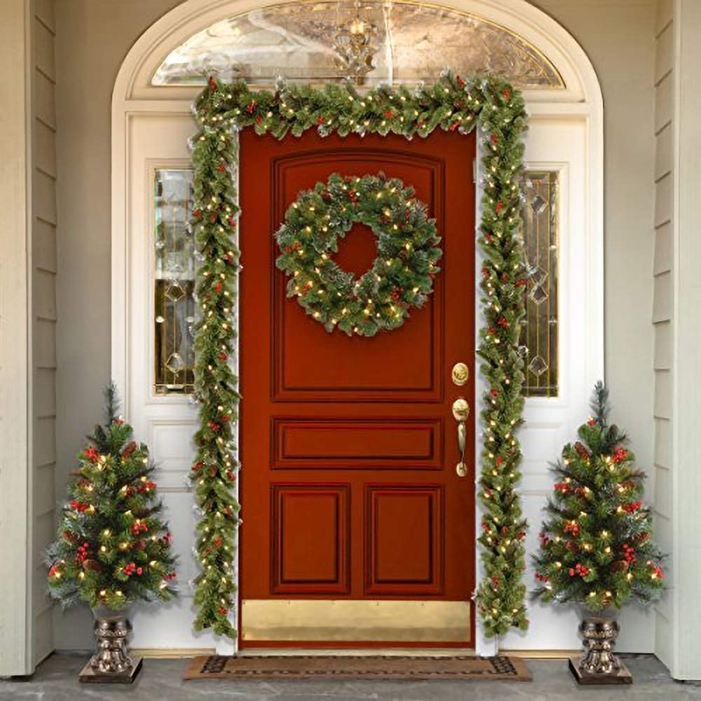 National Tree Company 24 in Pre-Lit Crestwood Spruce Artificial Christmas Wreath, Christmas Decoration with Glitter, Pinecones, Red Berries, 50 Clear Lights, 160 Tips, Green