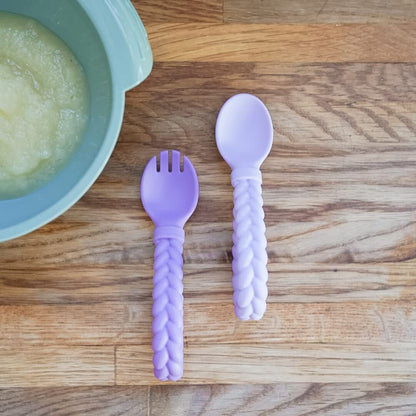 Itzy Ritzy Silicone Spoon & Fork Set; Baby Utensils Featuring a Baby Fork and Spoon with Looped, Braided Handles - Made of 100% Food Grade Silicone & BPA-Free - Ages 6 Months and Up (Amethyst/Purple)