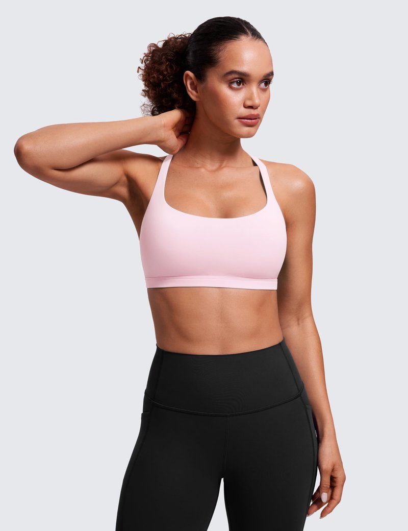 CRZ YOGA Naked Feeling Strappy Sports Bras for Women - Criss Cross Back Wireless Padded Cami Yoga Workout Top Strawberry Pink Small