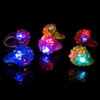 Super Z Outlet Flashing Colorful LED Light Up Bumpy Jelly Rubber Rings Finger Toys for Parties, Event Favors, Raves, Concert Shows, Gifts (18 Pack)