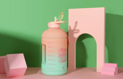 H2O Capsule INSPO Gallon Water Bottle with Time Marker and Straw Motivational Hydration Tracker Jug Big BPA-Free Food-Safe Leakproof Drinking Bottle with Handle & Strap, Lotus Blossom