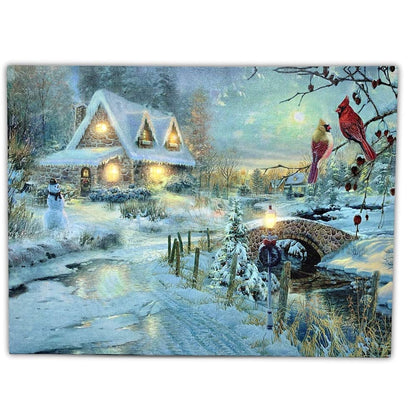 BANBERRY DESIGNS LED Christmas Wall Art - Lighted Cottage Along a Stream Christmas Scene with Cardinals and Snowman - LED Canvas Prints - Old Fashioned Cobblestone Bridge - Measures 11.75" x15.75"