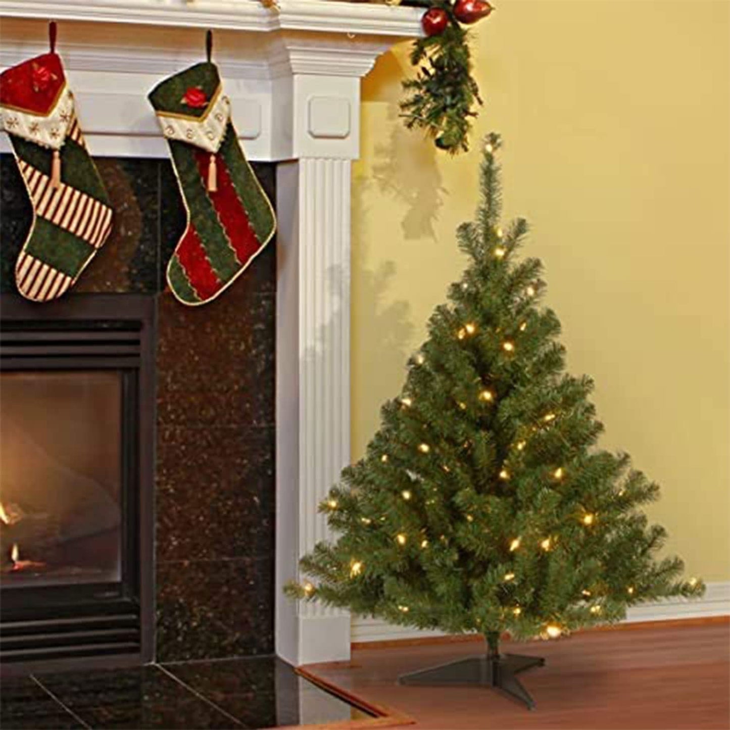 National Tree Company 4 ft Pre-Lit Kincaid Spruce Mini Artificial Christmas Tree, 100 Clear Lights, 269 Tips, Includes Stand, Green