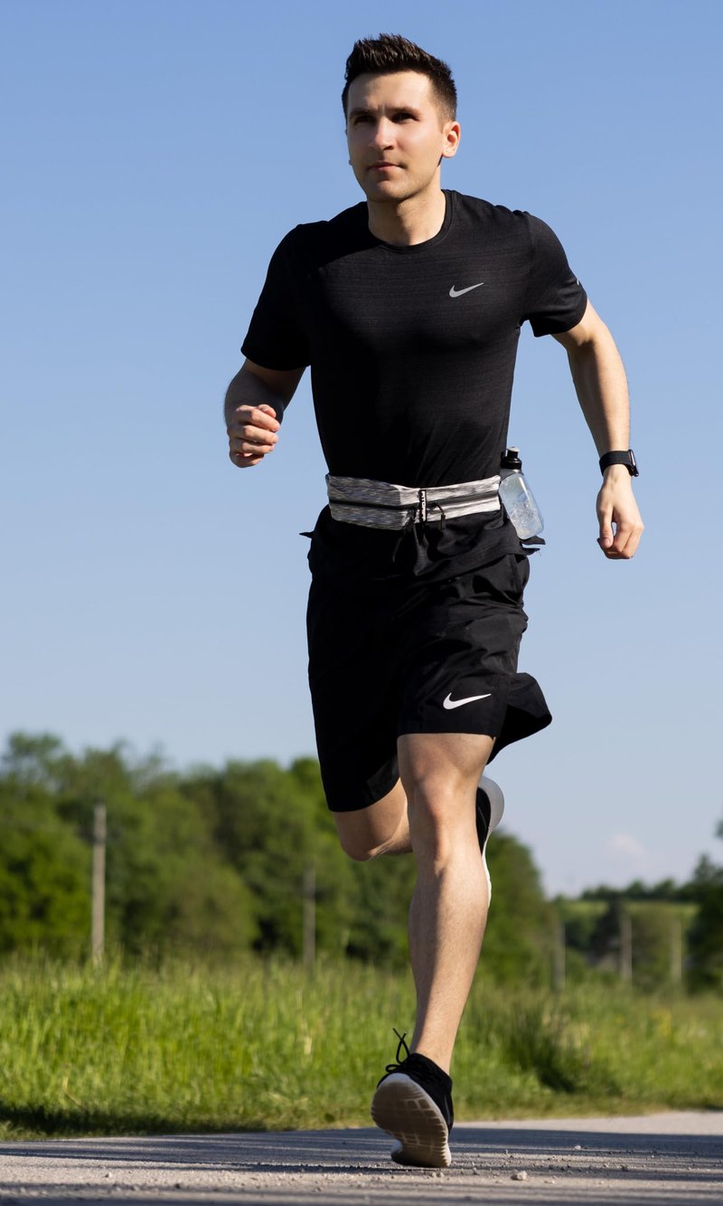 Fitgriff® Running Belt for Men & Women - Secure Jogging Pouch for Phone, Keys & Essentials - For All Cell Phones (Whtie, 33.5" - 47.5" Waist Size)