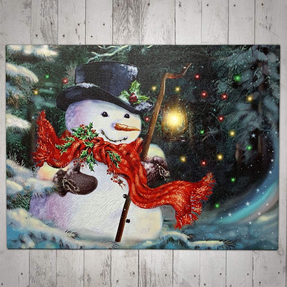 BANBERRY DESIGNS LED Wall Art - Lighted Snowman Canvas Print - Christmas Wall Hanging Snowman with a Red Scarf Holding a Lantern - Winter Holiday Scene 11.75" H x 15.75" W