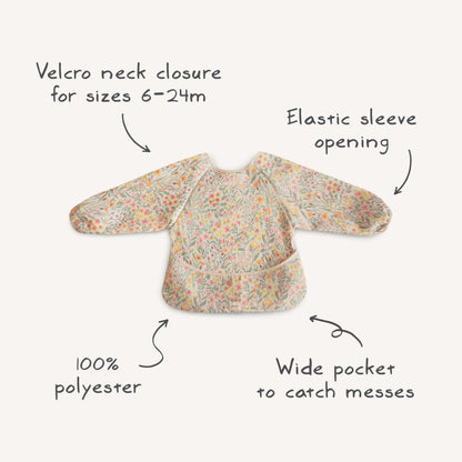 mushie Long Sleeve Baby Bib | Water Resistant Adjustable Fit for Ages 6-24 Months (Retro Flowers)