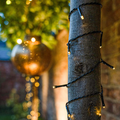 Festive Lights - 10m Solar Power Multi Function Fairy String Lights with 100 Warm White LEDs - IP44 Rated, Outdoor Decorative Lighting - External Panel, Black Cable, Garden Trees, Fences & Pergolas