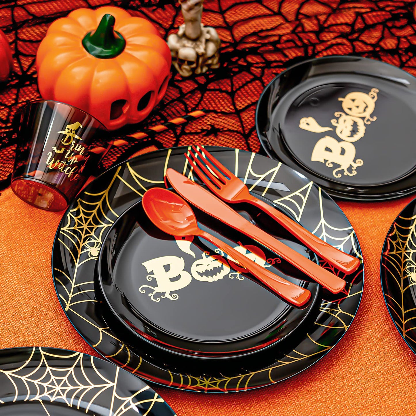 ISFANGCO 150PCS Plastic Spoof Black Dinnerware Set for 25 Guests with Gold Spider Web & Smiley Pumpkin,Heavy Duty Plastic Orange Disposable Cutlery,Gold Witch Printed Black Cups