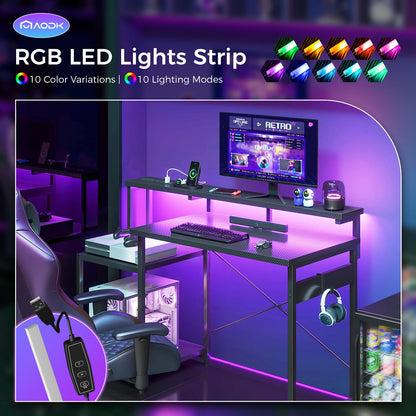 AODK Computer Desk, 48 Inch Gaming Desk with Led Lights & Power Outlet, Office Desk with Printer Storage Shelves, Reversible Desk with Monitor Shelf & Headphone Hook, Carbon Fiber Black