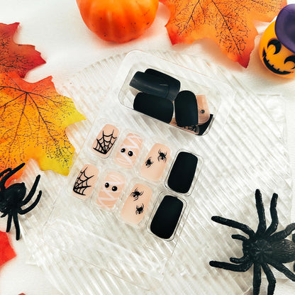 Halloween Press on Nails Medium Square Fake Nails Matte Glue on nails Nude False Nails with Cute Mummy Spiders Webs Design Halloween Nails Black Full Cover Stick on Nails for Women Girls 24 Pcs
