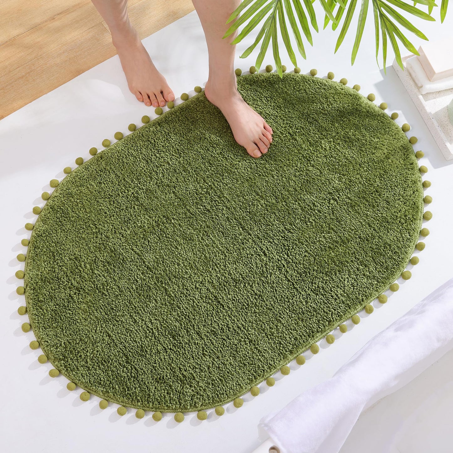 YIRDDEO Bath Mat Olive Green Oval Rug with Pom Bathroom Rugs for Bedroom Non Slip Cute Boho Absorbent Mats Soft Plush Washable Rug (24x36 inches)